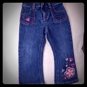 Blue jeans with pink and silver hearts and flowers